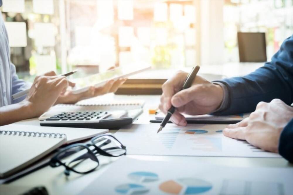 couple at desk working on documents