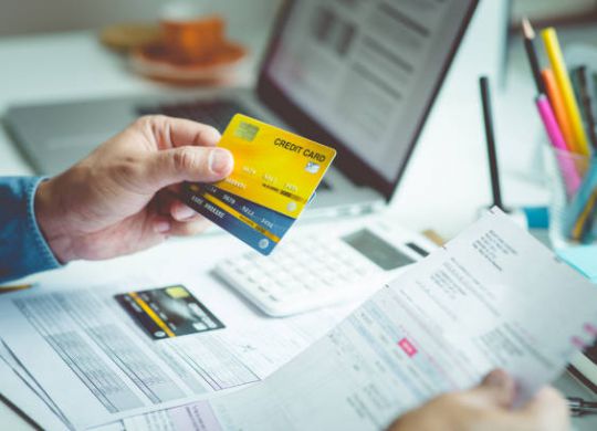 Person paymant bill with credit card on desk table.business financial and cost concepts